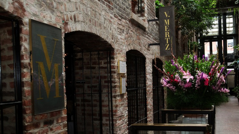 A rustic stone entryway to a fine-dining restaurant