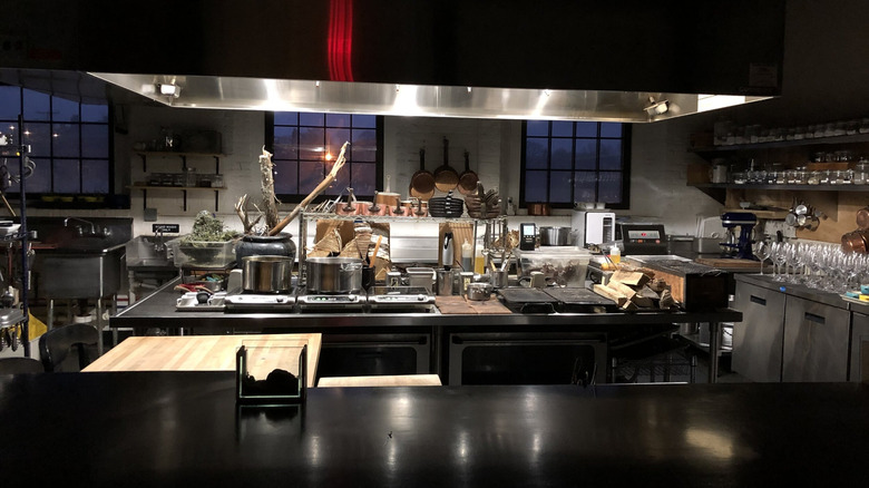 A professional restaurant kitchen with pots and pans