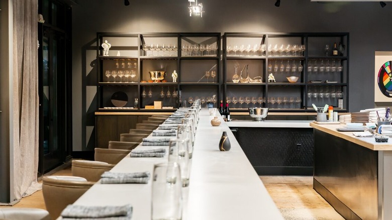 A modern dining room with a long serving counter