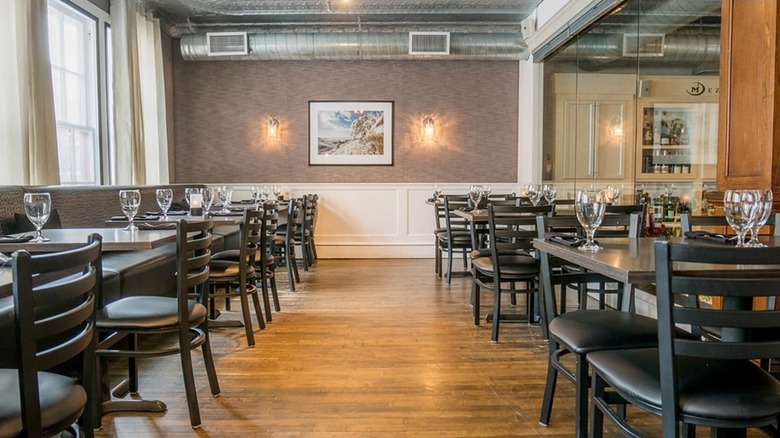 An industrial-chic dining room with set tables
