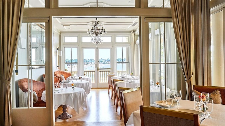 A light-filled, elegant dining room with an ocean view