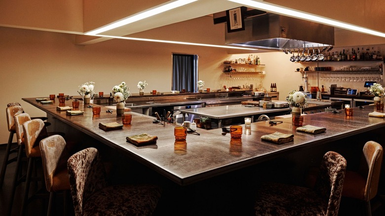 A U-shaped dining counter at a fancy restaurant