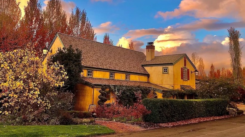 A rustic cottage-like building at sunset