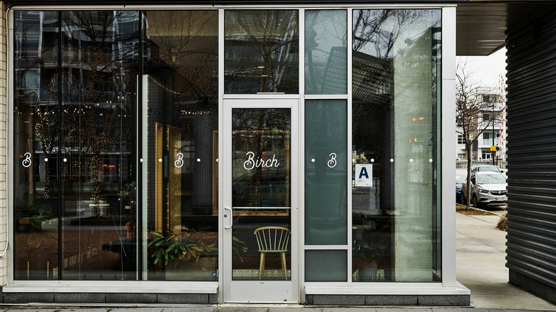 A glass-walled restaurant exterior