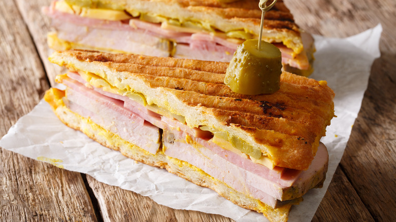 Pressed Cubano sandwich cut into two wedges