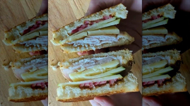 Two halves of a Vermonter sandwich, bird's-eye view