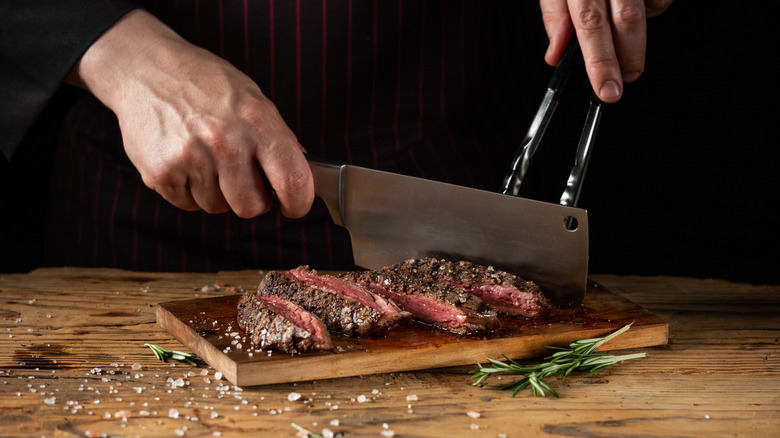 Chef slicing up a steak