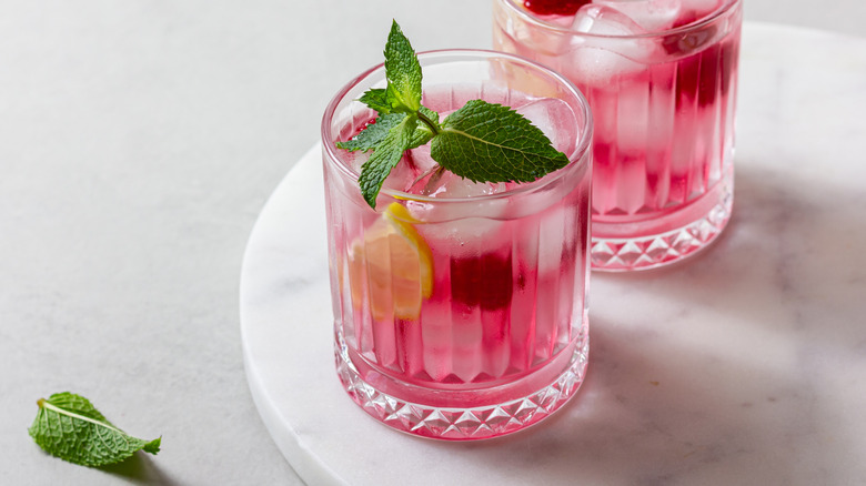 Pink non-alcoholic drinks with fresh mint and lemon