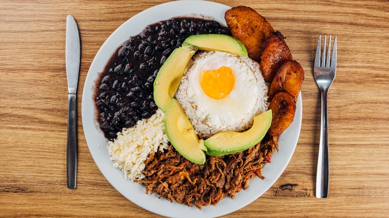 Venezuelan pabellón criollo, fried egg and avocado