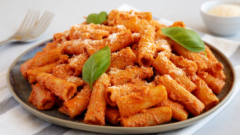 served penne al la vodka on plate with basil garnish