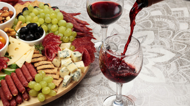 Charcuterie board with red wine