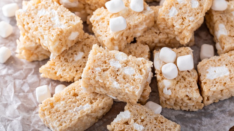 Rice Krispies Treats with marshmallows on parchment