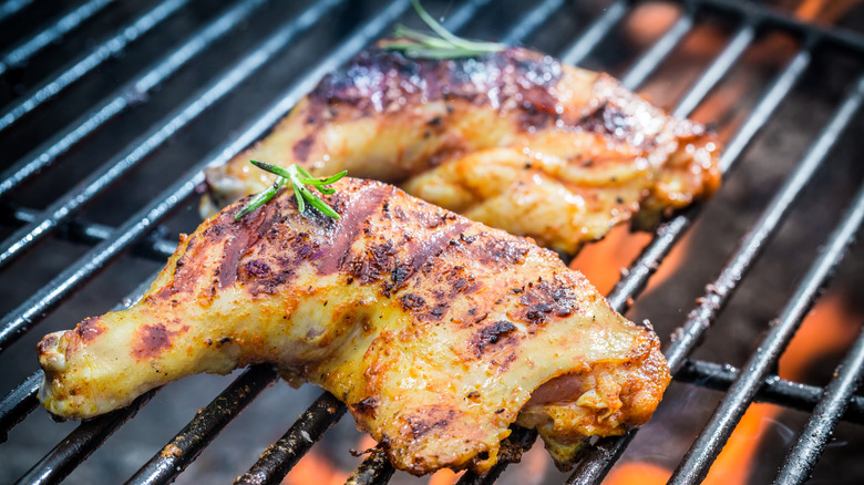 Grilled chicken on the grill cooking