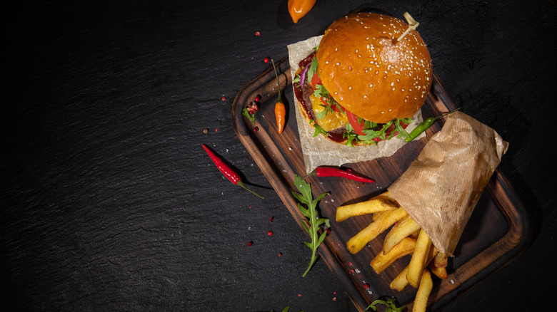 Burger on table with fries