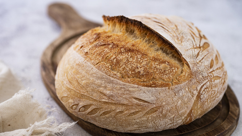 loaf of scored sourdough bread