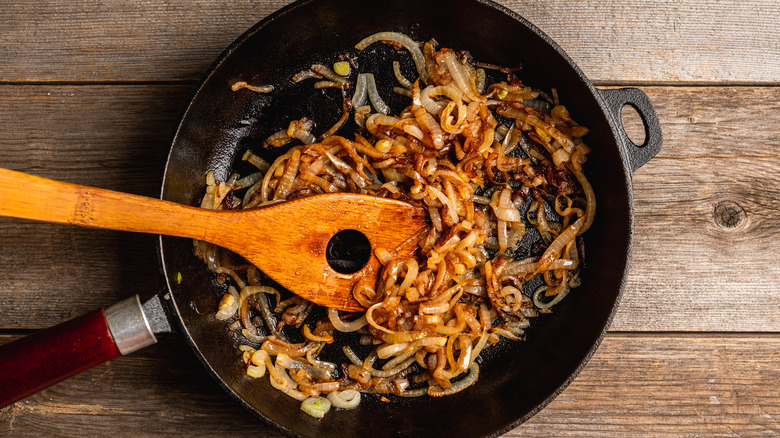 Caramelized onions in a frying pan.