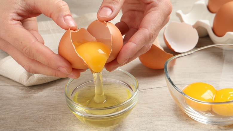 Cracking eggs in a bowl