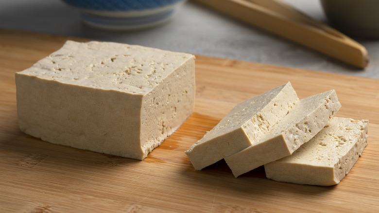 slab of sliced tofu on cutting board