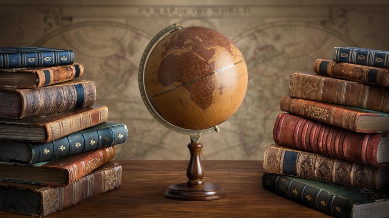 Old globe with books
