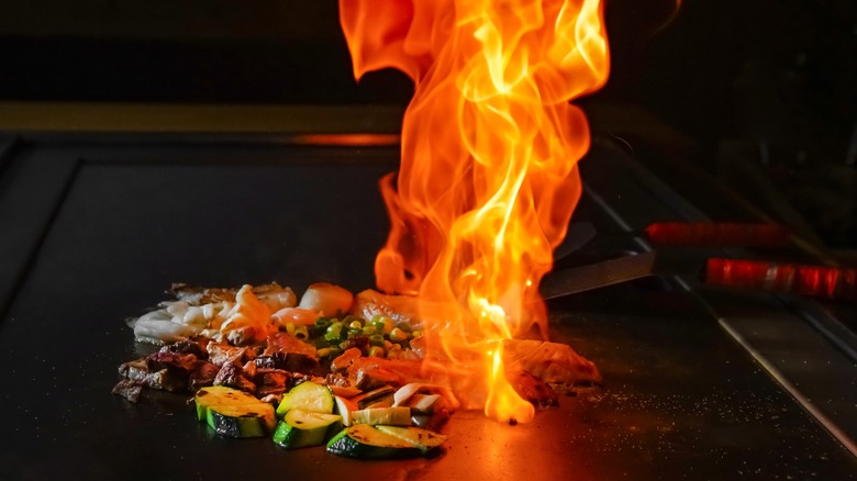 Teppanyaki cooking with flame