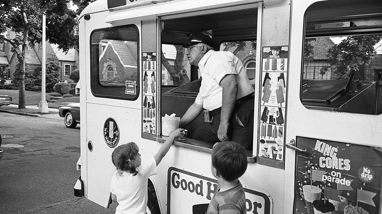 Vintage ice cream truck serving kids