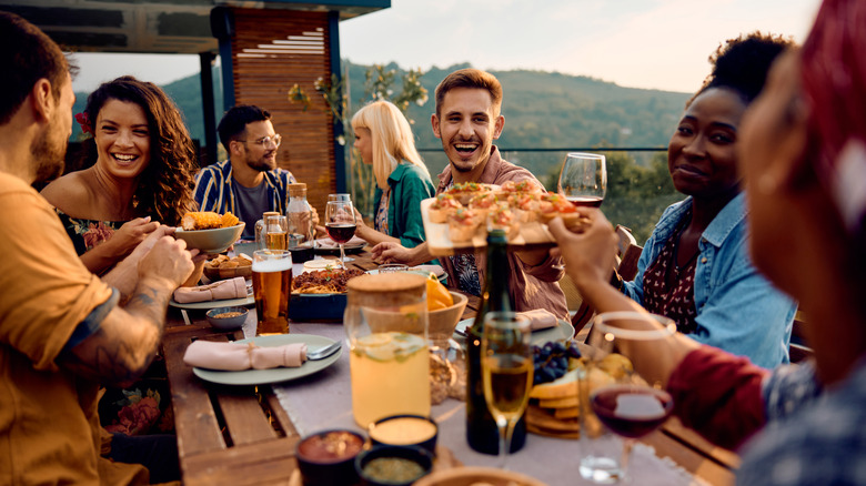 Friends dining outside 