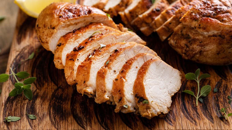 Sliced chicken breast on a cutting board