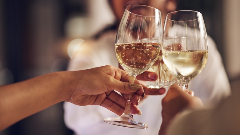 People toasting with sparkling white wine