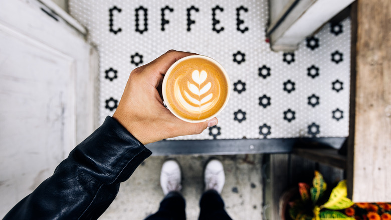 A latte over a coffee doormat