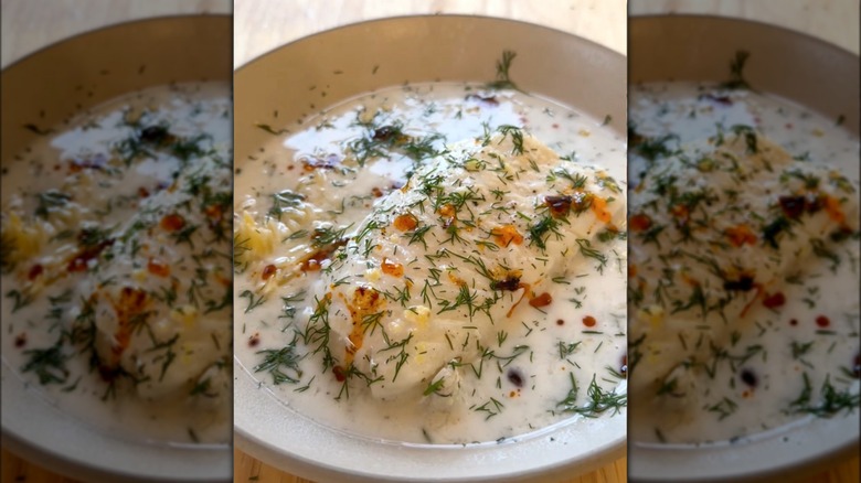 Coconut milk poached fish with herbs