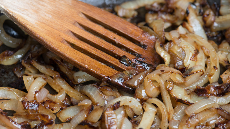 Caramelized onions and wooden spoon