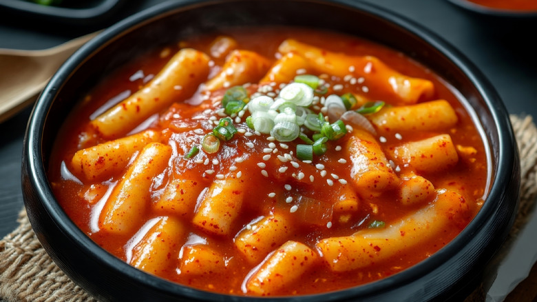 Korean rice cake dish with a garnish on top