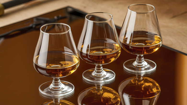 three glasses of whiskey