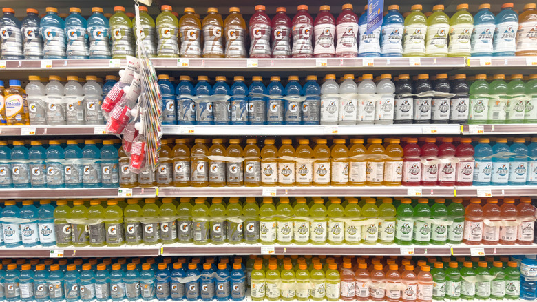 Grocery shelves stocked with different flavors of Gatorade