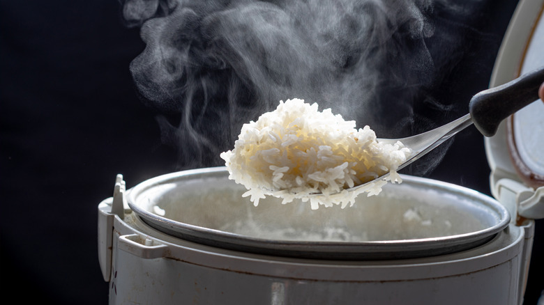 Steaming jasmine rice from cooker