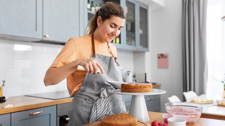 Woman icing a cake