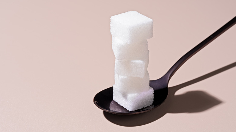 Sugar cubes on a spoon