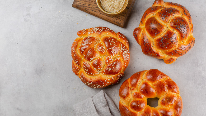 Three Challah breads on counter