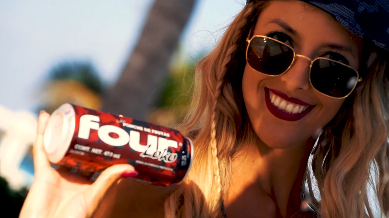 Woman holding Four Loko can