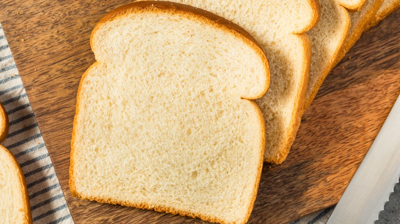 Slices of white bread on a cutting board