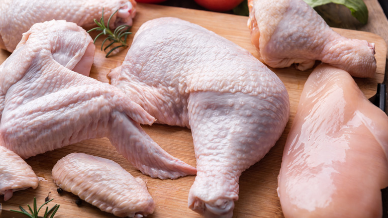 Whole, raw chicken cut into parts