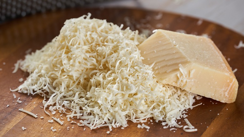 Grated Parmesan on a cutting board