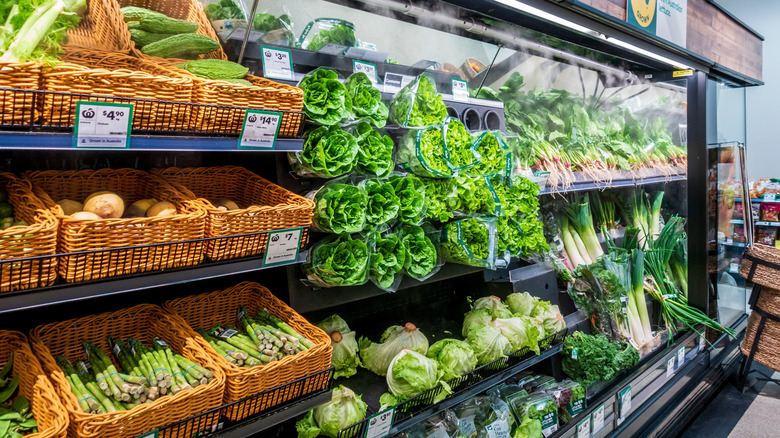 A produce aisle getting misted at grocery store