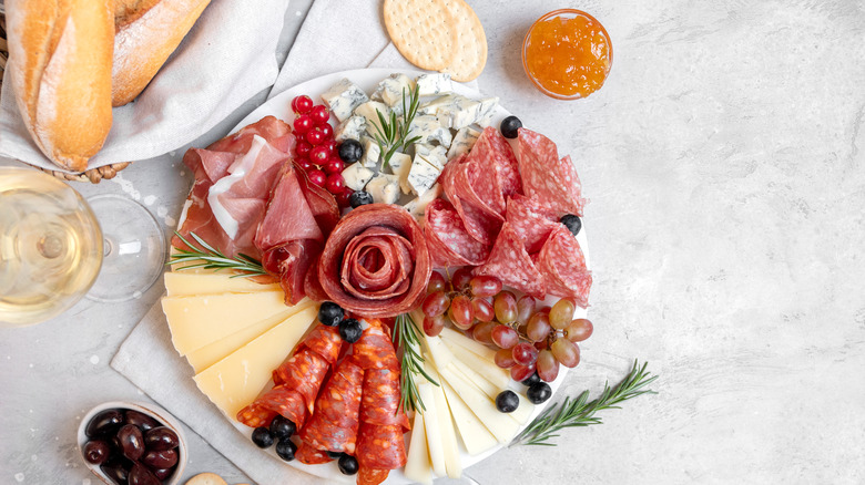 A large charcuterie board with a lot of variety