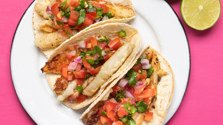 Plate of white fish tacos with pico de gallo