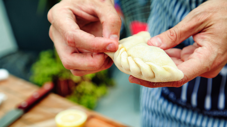 Person making empanadas