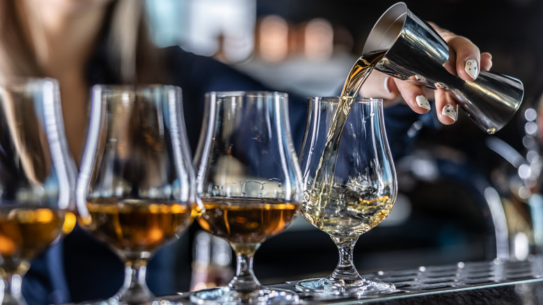 bourbon poured into glasses