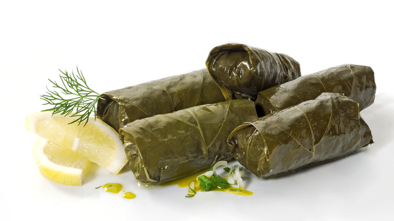 Dolmas garnished with lemon and dill