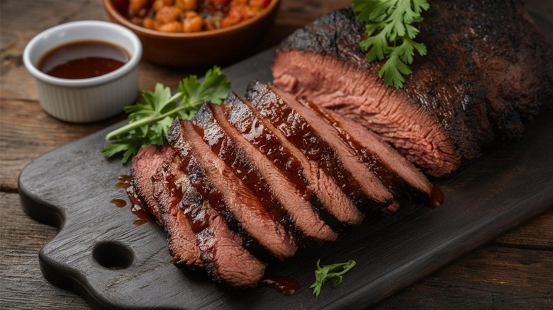 Lovely sliced brisket on a cutting board.