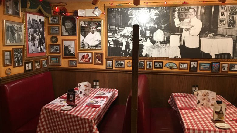 Red-checked tablecloth tables inside of a Buca di Beppo